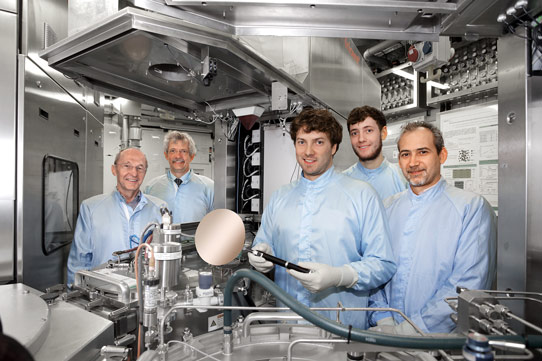 (From left) Professor Siegrfried Mantl, professor Detlev Grützmacher, Stephan Wirths, Nils von den Driesch, and Dr Dan Mihai Buca of the Peter Grünberg Institute (PGI-9), standing next to a CVD system used to prepare and develop parts of the new laser. Copyright: Forschungszentrum Jülich 